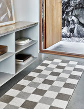 Load image into Gallery viewer, cream and linen checkered rug in an entry way 
