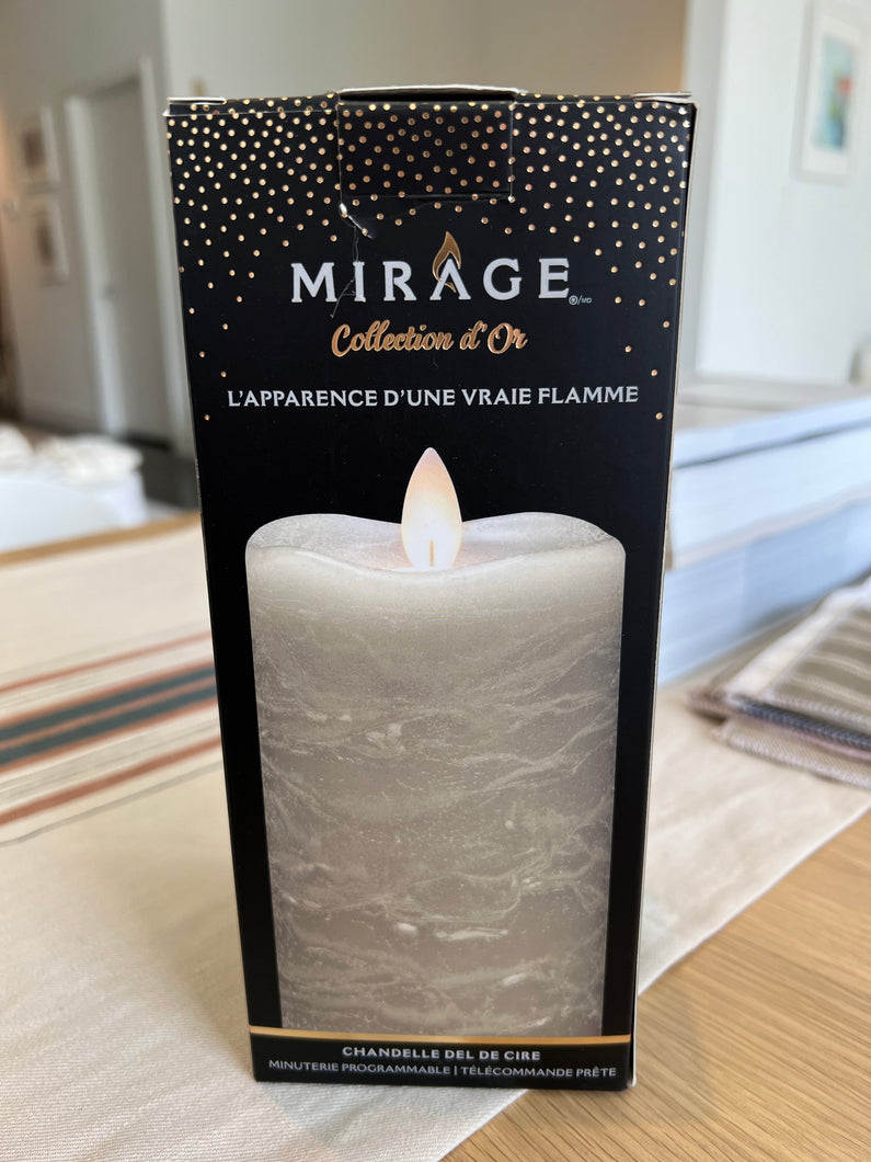 mirage gold wax candle in the box on a wooden table