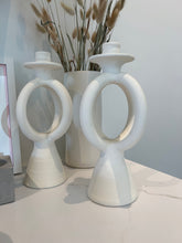 Load image into Gallery viewer, two double O candle holders with a white tall vase and pompous grass 
