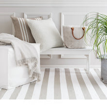 Load image into Gallery viewer, whie puff in a sitting area with a bench and cream colored pillows
