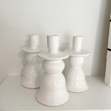 Load image into Gallery viewer, three classic candle holders on a white shelf
