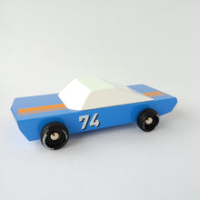 Load image into Gallery viewer, A blue racecar with white top, black wheels, and number 74 on the door.  It has an orange stripe on the hood and trunk.
